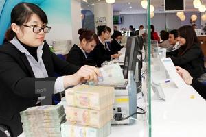 Ngành ngân hàng và những cuộc mua lại "nhà băng" giá 0 đồng