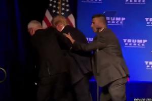 Nhân viên mật vụ vội vã đưa ông Donald Trump rời khỏi sân khấu