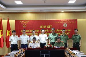 Cục Thuế và Cục Quản lý xuất nhập cảnh ký quy chế phối hợp thông tin tạm hoãn xuất cảnh bằng điện tử